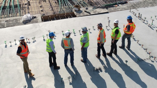 Construction Team Discussing Onsite Project